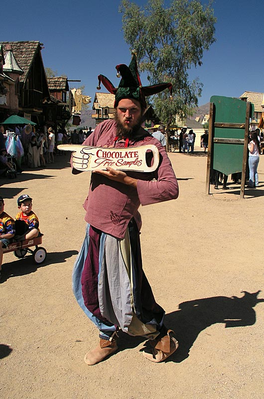 One of the many players making the experience of the Renaissance Festival all the more real inviting passers by to try the chocolates here in Arizona 